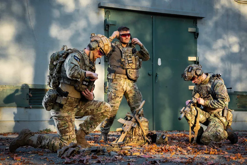 Soldiers with Warrior Assault Systems gear preparing for a mission