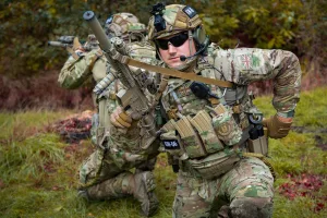 Soldier with Warrior Assault Systems gear reloading his M4